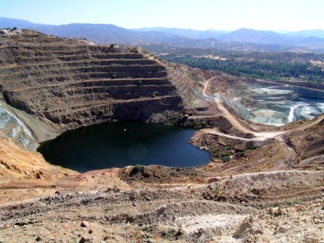 Figure 15: Skouriotissa mine, looking south-west. The Karkotis Valley is the first valley above the grey pit, with Pano Limna (TS15) at the base of the ridge. Photograph: Kristina Winther Jacobsen. 