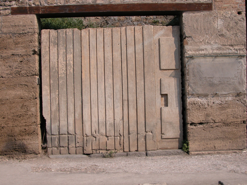 Cast of the void left by wooden partitions at a shop on the Via Abbondanza