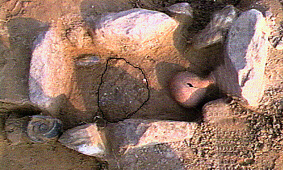 cremation tomb surrounded by stones.