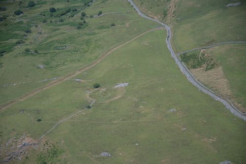 Figure A: View of Erw-wen enclosure, terraced into north-west facing slope. (Image: T. Driver, Crown Copyright RCAHMW, AP-2006_3561)