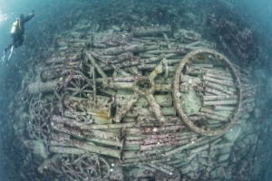 Diver surveying a protected wreck