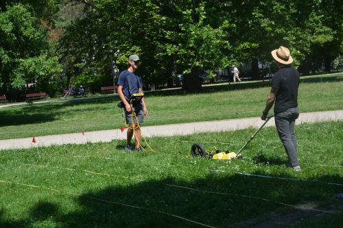 two people conducting scientific research in a park