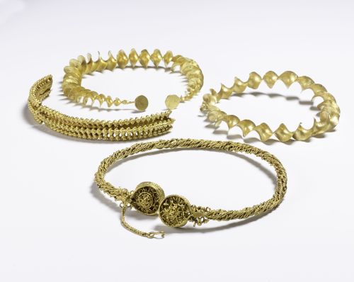 Photo of hoard of torcs set against a white background